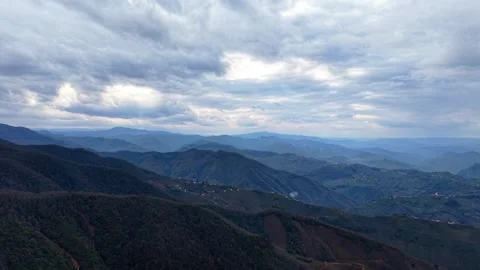 Ultra Slow Motion Drone Rising Over Moody Autumn Forest and Dark Overcast Sky Stock Footage 335073227