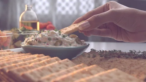 Ultra Slow Motion Shot of Cracker in a White Dip Stock Footage 113332746