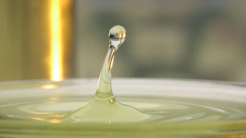 Ultra Slow Motion Shot of Drop of Oil Causing Ripples Stock Footage 113332589