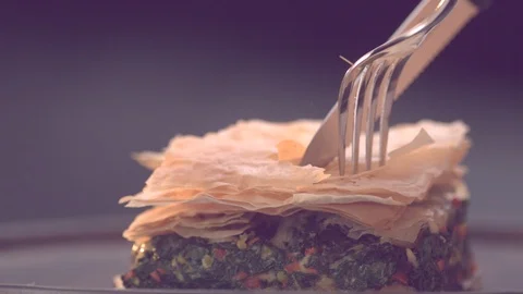 Ultra Slow Motion Shot of Fork and Knife Cutting Pastry Stock Footage 113335641