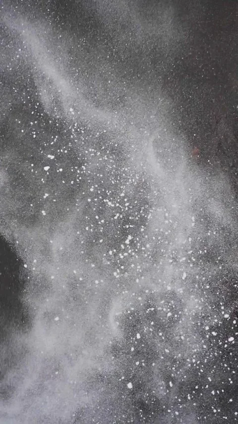 Ultra Slow Motion Snow Falling into River with Abstract Powder Patterns - Cinema Stock Footage 326216500