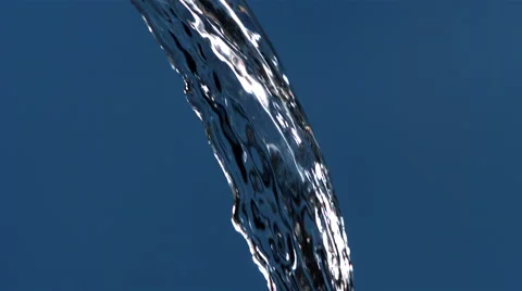 Ultra-slow motion stream of water curving from top of blue frame Stock Footage 59527253