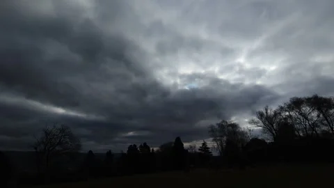 Ultra Wide View of Dark Stormy Clouds Over Silhouetted Trees with Big Lightning Stock Footage 304637397
