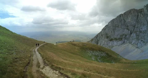 Ultra-wide view on the footpath on Savin Kuk mountain top on a cloudy, windy day Stock Footage 191827544
