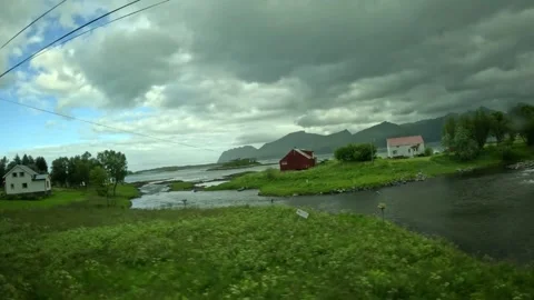 Ultra wide view past river estuary, houses, and fjord in Senja Norway Vídeo Stock 342340392