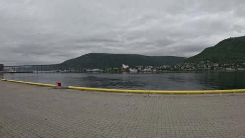 Ultra wide view of Tromso harbor pier Arctic Cathedral and Storsteinen mountain Stock-Footage 341697351