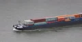 UltraHD 4K Fluvial Cargo Tug Boat Passing Container Ship China Shipping Maersk 4k or 4k+ Resolution