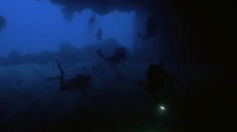 UltraHD group of scubadivers explore underwater caves, under water shot, Palau 스톡 동영상 47135126