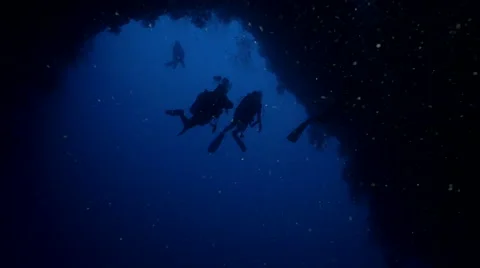 UltraHD scuba divers enter huge underwater cave, Palau Video stock 47133543