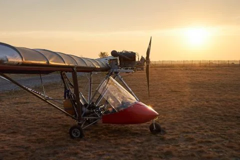 Ultralight single-engine single-seat aircraft stands on the airfield Stock Photos