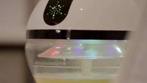 Ultrasonic Aroma Diffuser Emitting Scented Mist, Colorful Mood Light, Close Up Vídeo Stock 341308841