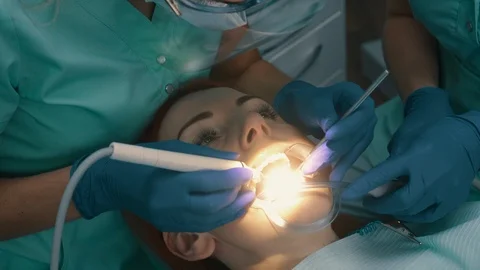 Ultrasonic cleaning of teeth. Removal of solid teeth. Stock Footage 104784825