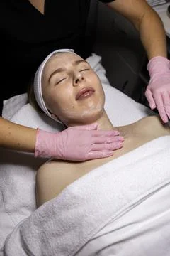 Ultrasonic cleansing of the entire face of a young Caucasian woman Stock Photos