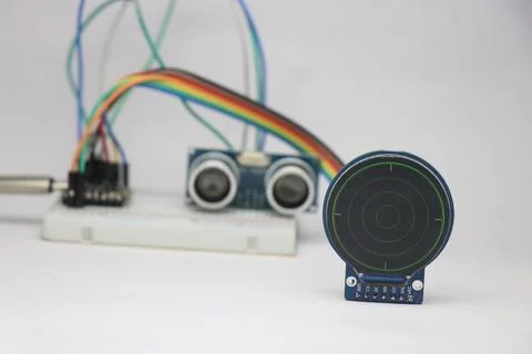 Ultrasonic distance sensor on the breadboard connected to round lcd display Stock Photos