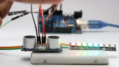 Ultrasonic distance sensor when detects an obstacle glows the LED strip Video stock 339018351