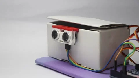 Ultrasonic sensor senses obstacle and open the lid using the micro servo Stock Footage 321893254