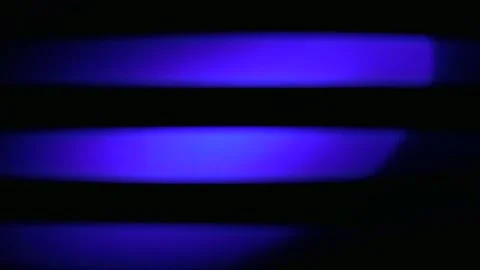 Ultraviolet Blue Stripes Create a Mesmerizing UV Light Display in a Darkene.. Stock Footage 345365060