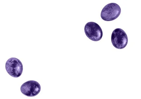 Ultraviolet colored Easter eggs on isolated white background. Flat lay. Stock Photos