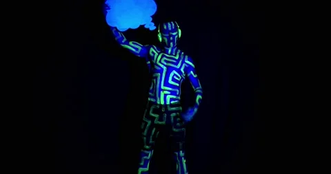 Ultraviolet light, a man is holding a comic cloud and starts dancing, 4k Stock Footage 136075813