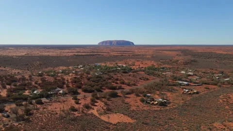 Uluru Rock From Coach Campground Accommodations And Yulara Town - Stock Footage 150588198