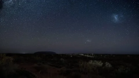 Uluru/Ayers rock under millions of stars and Magellanic clouds timelapse video Stock Footage 130928834