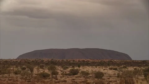 Uluru/Ayers Rock  under rain clouds 8K time lapse video Stock Footage 130225548