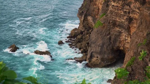 Uluwatu stone cliffs, ocean waves. Aerial top view. Bali, Indonesia. Stock Footage 83634239