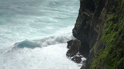 Uluwatu stone cliffs, ocean waves. Aerial top view. Bali, Indonesia Stock Footage 83708420