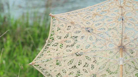 Umbrella and the gramophone on a retro picnic by the river 3 Stock Footage