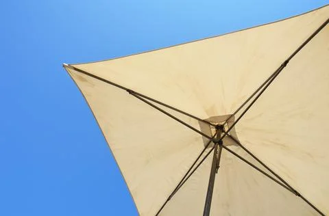 Umbrella on the background of the sky Stock Photos