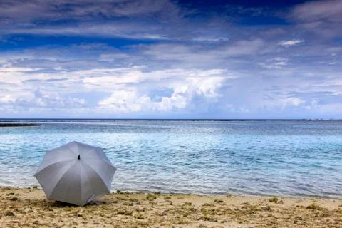 Umbrella by the beach Stock Photos