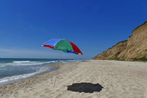 Umbrella is on the beach Stock Photos