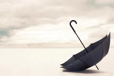 Umbrella in a desert Stock Photos