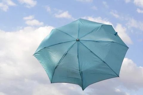 Umbrella floating in the sky Stock Photos