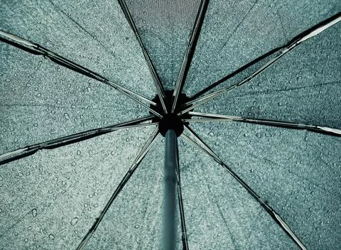 Umbrella inside, dripping rain Stock Photos