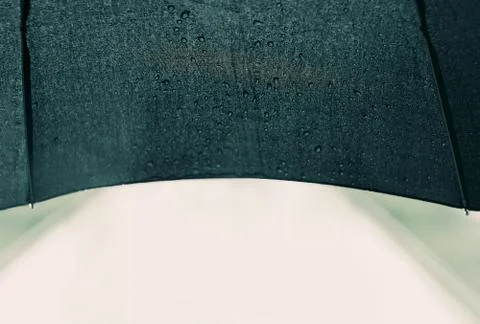 Umbrella inside, rain drops Stock Photos