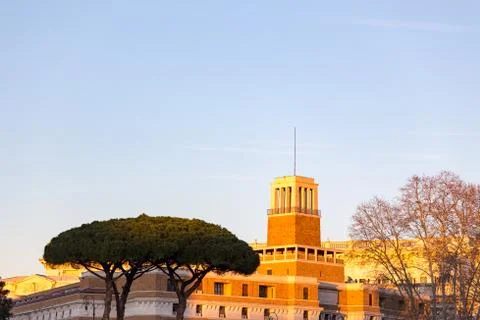 Umbrella pine trees in front of castle in mediterranean architecture in rome Stock Photos