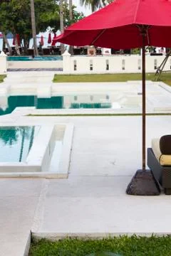 Umbrella at the pool Stock Photos