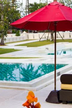 Umbrella at the pool Stock Photos
