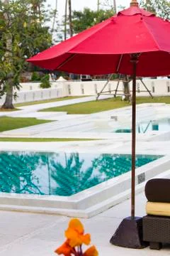 Umbrella at the pool Stock Photos