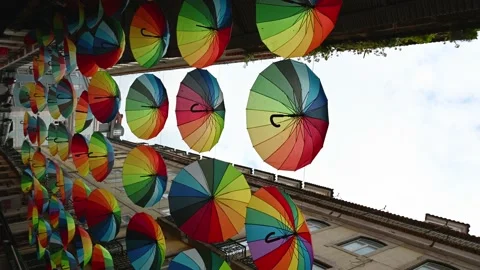 Umbrella with the rainbow pride flag vertically. 4K Stock Footage 234069216