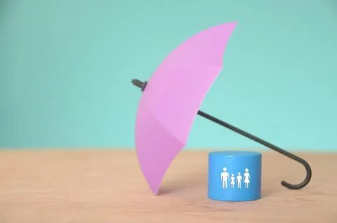 The umbrella represents the coverage provided by insurance policies, shield.. Stock Photos