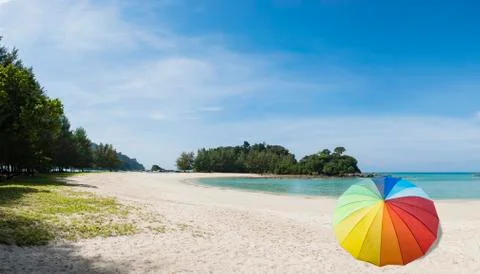 Umbrella on a sandy beach Stock Photos