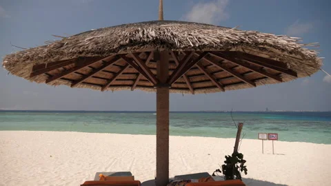 Umbrella on the small island in the ocean, Maldives Stock Footage 183020853