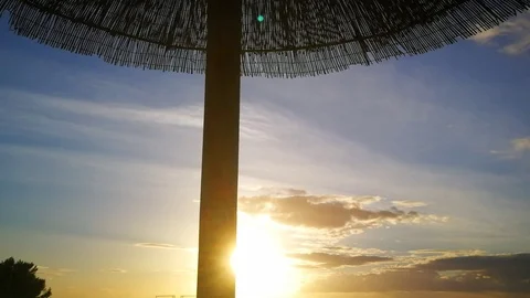 Umbrella Sunset slow tracking shot Stock Footage 97605422