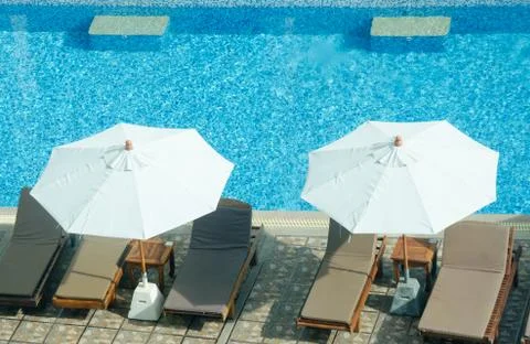 Umbrellas and chairs Stock Photos