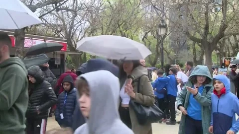 Umbrellas are making a timid reappearance in Barcelona, Barcelona, ES - 19 Apr 2 Stock Footage 307044612