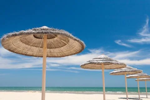 Umbrellas on the beach Stock Photos