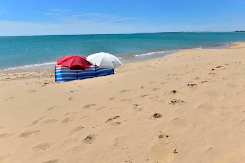 Umbrellas on the beach Stock Photos