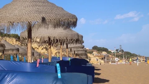 Umbrellas on beautiful summer beach Stock Footage 116725973